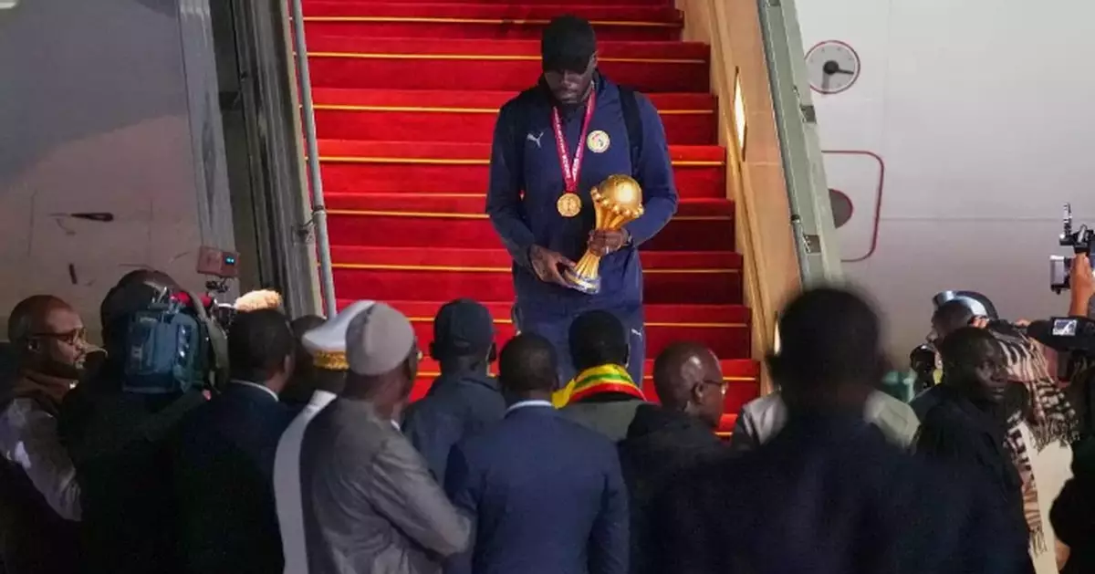 Senegal President greets team as triumphant players receive heroes welcome in Dakar