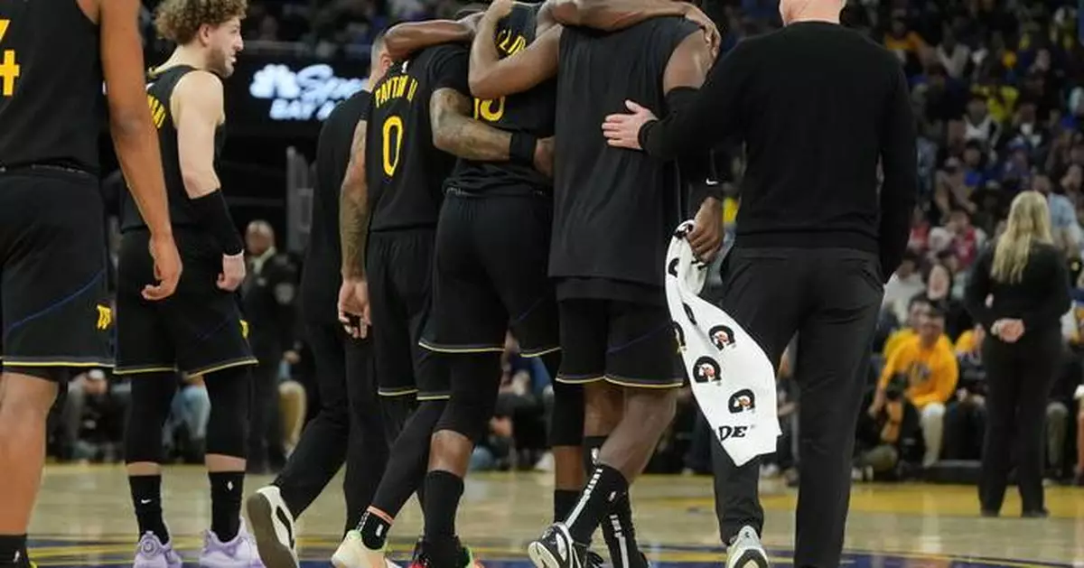 Warriors star Jimmy Butler goes down with right knee injury in win over Heat