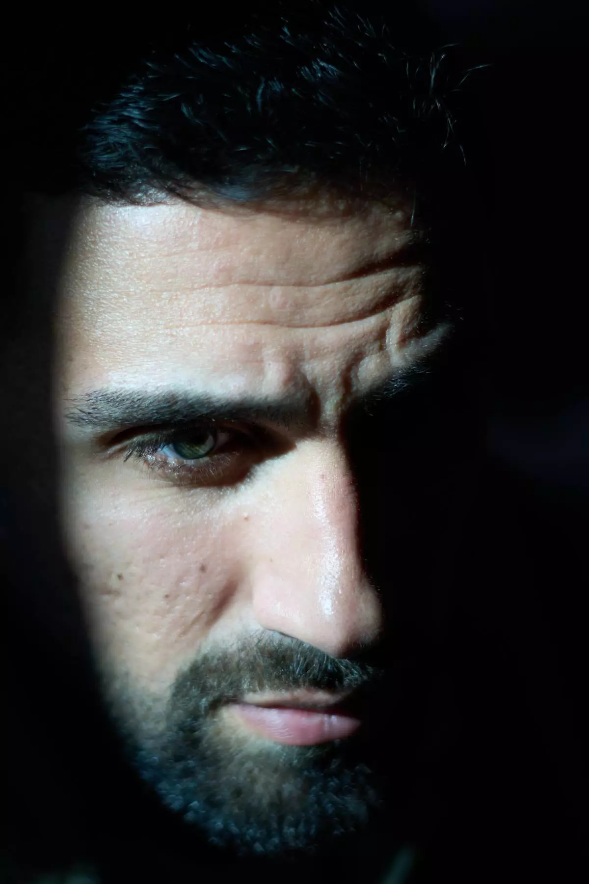 Segev Kalfon, an Israeli hostage who spent two years in captivity in a Hamas tunnel and was released from the Gaza Strip in a ceasefire deal on Oct. 13, looks on at his home in Dimona, southern Israel, Tuesday, Dec. 23, 2025. (AP Photo/Ariel Schalit)