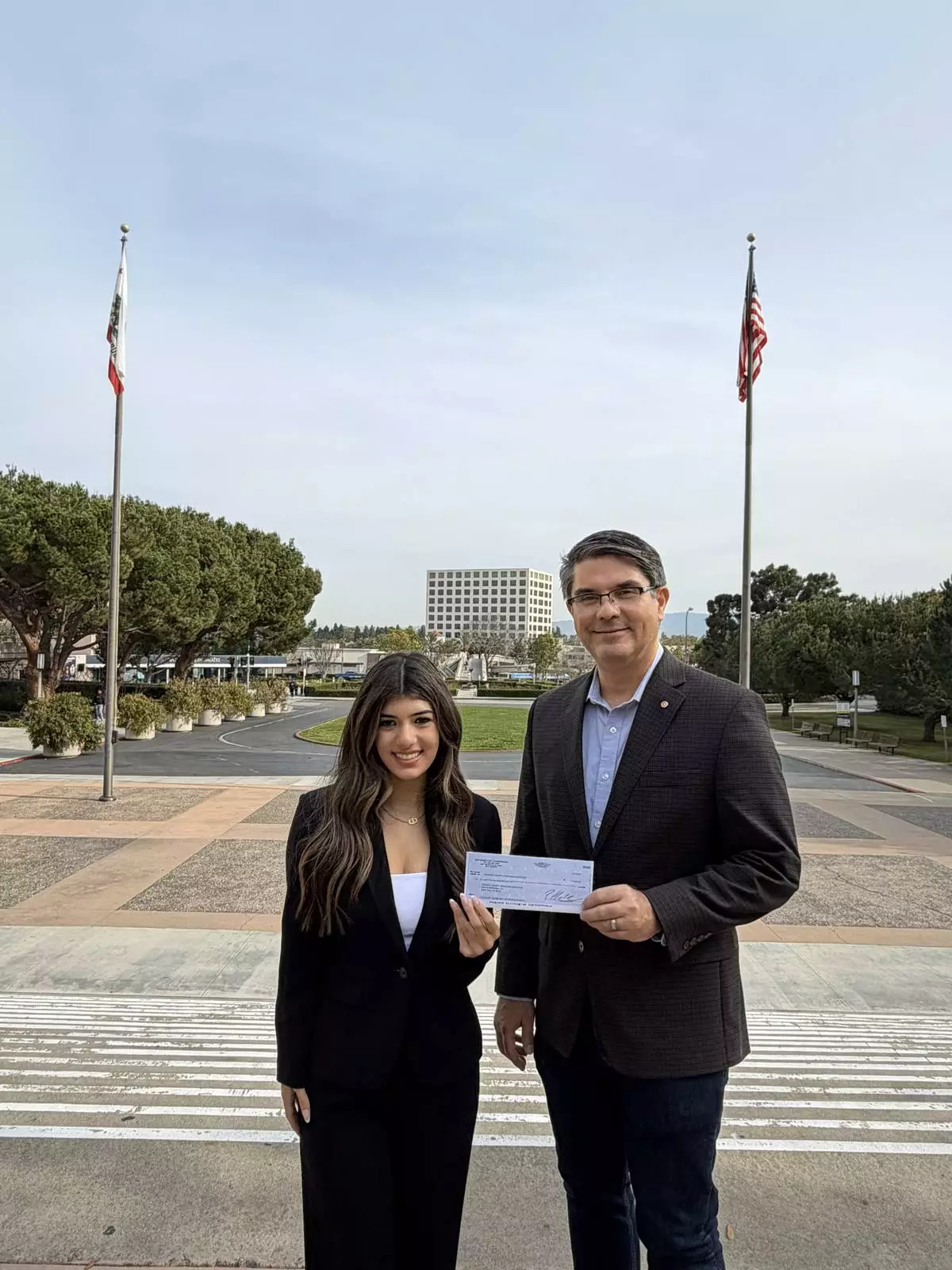 Sophia Makhail with Dr. Kevork Abazajian, UCI professor and Chair of the Orange County Armenian Genocide Memorial, during the presentation of a $2,500 contribution supporting memorial education efforts.