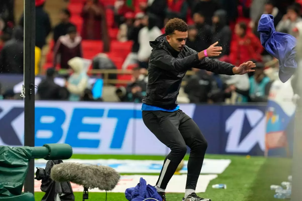 A ball boy throws a towel used by Senegal's goalkeeper Edouard Mendy, during the Africa Cup of Nations final soccer match between Senegal and Morocco, in Rabat, Morocco, Sunday, Jan. 18, 2026. (AP Photo/Mosa'ab Elshamy)