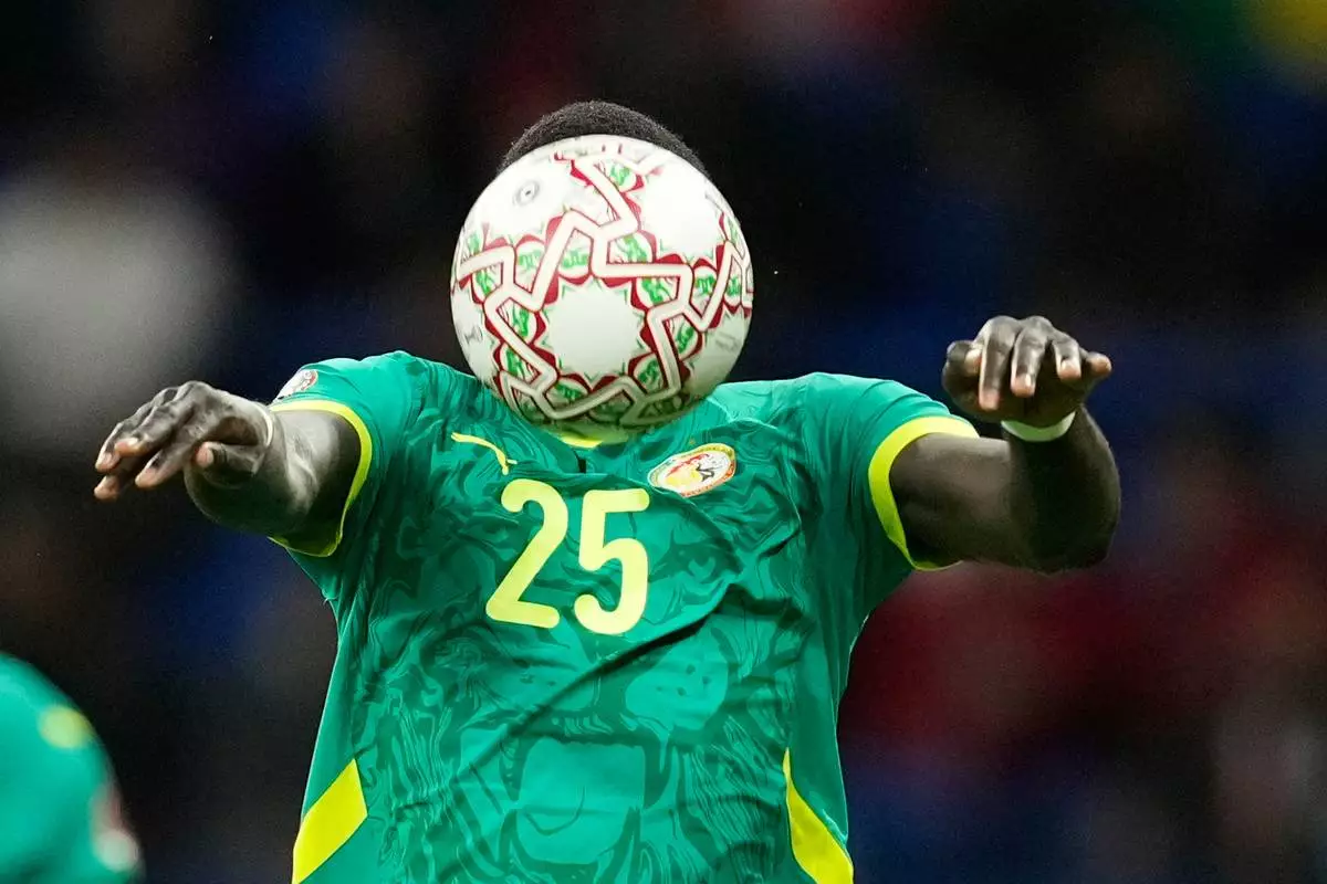 Senegal's El Hadji Malick Diouf heads the ball during the Africa Cup of Nations best of 16 soccer match between Senegal and Sudan in Tangier, Morocco, Saturday, Jan. 3, 2026. (AP Photo/Mosa'ab Elshamy)