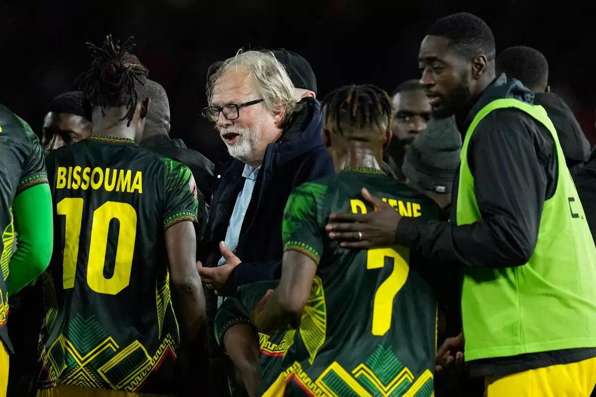 Mali's head coach Tom Saintfiet talks to players before the ectra time during the Africa Cup of Nations best of 16 soccer match between Mali and Tunisia in Casablanca, Morocco, Saturday, Jan. 3, 2026. (AP Photo/Themba Hadebe)