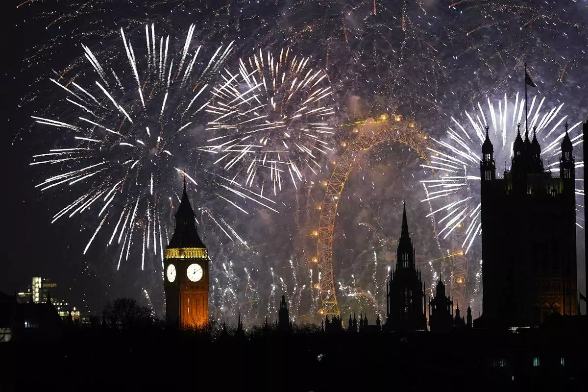 FILE - Fireworks light up the sky in central London to celebrate the New Year on Thursday, Jan. 1, 2026. (AP Photo/Alberto Pezzali, File)
