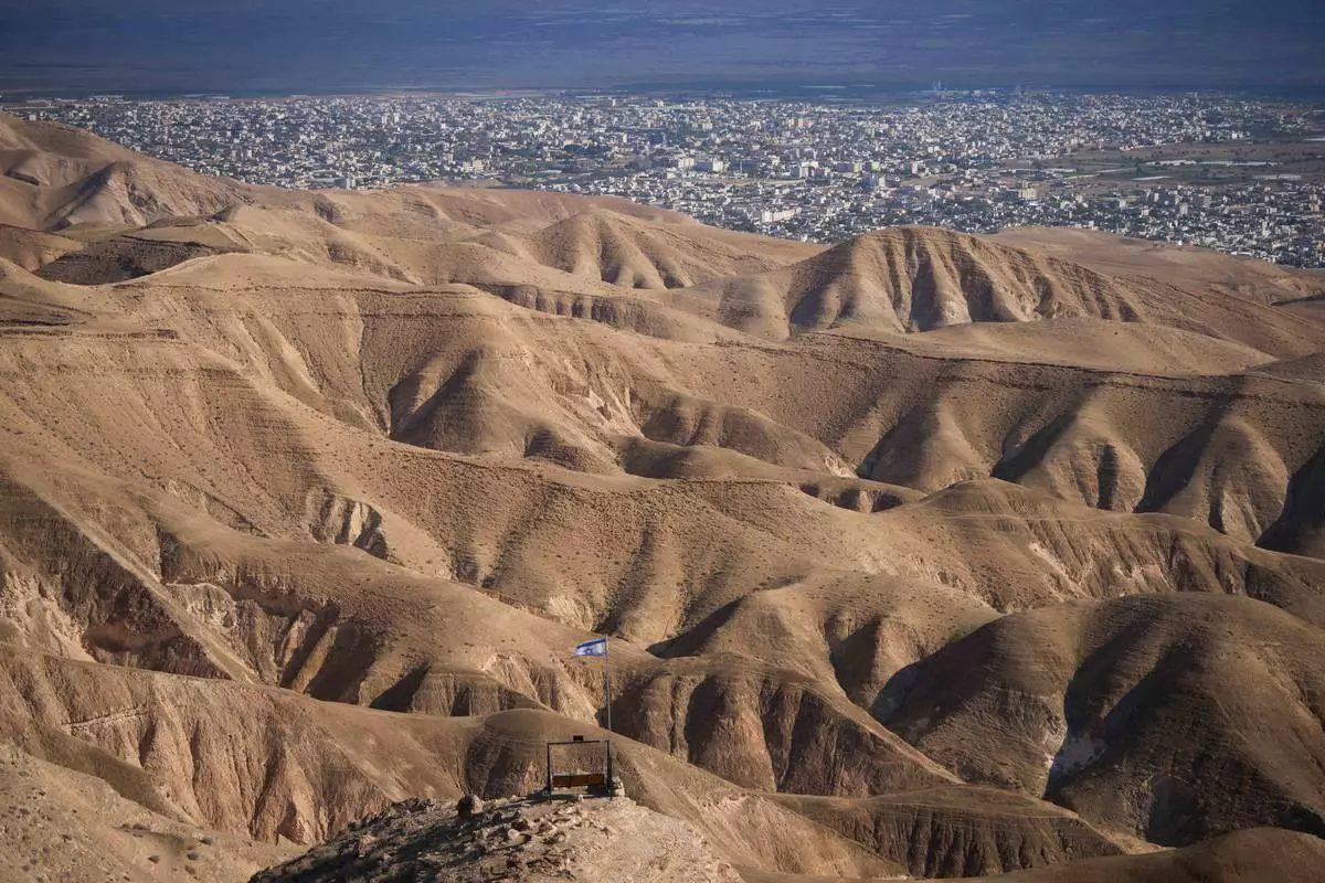 FILE - The Palestinian city of Jericho, seen from the Israeli settlement of Mitzpe Jericho in the West Bank, Dec. 28, 2025. (AP Photo/Ohad Zwigenberg, File)