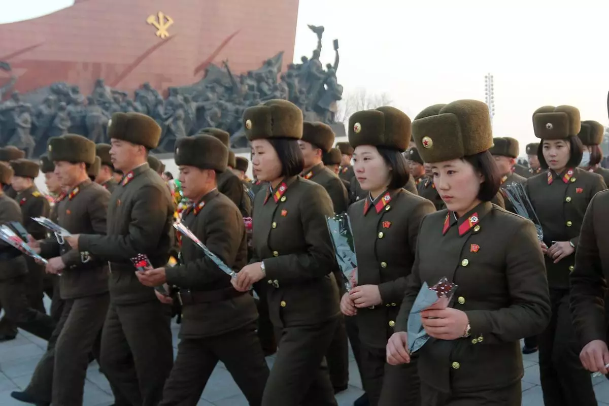 FILE - Pyongyang citizens and soldiers pay respect to the statues of President Kim Il Sung and Chairman Kim Jong Il on the 14th anniversary of Kim Jong Il's death in Pyongyang, DPRK, Dec. 17, 2025. (AP Photo/Cha Song Ho, File)