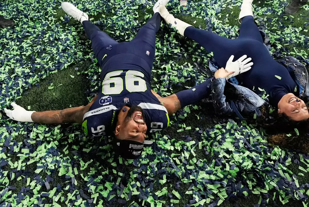 FILE - Seattle Seahawks defensive tackle Leonard Williams (99) celebrates after a win over the Los Angeles Rams in the NFC Championship NFL football game Sunday, Jan. 25, 2026, in Seattle. (AP Photo/Godofredo A. Vásquez, File)