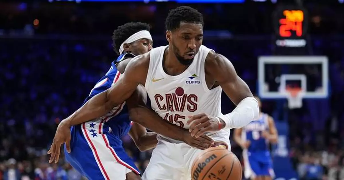 Mitchell has 35 points to power Cavs past 76ers 133-107 but Garland exits with foot injury