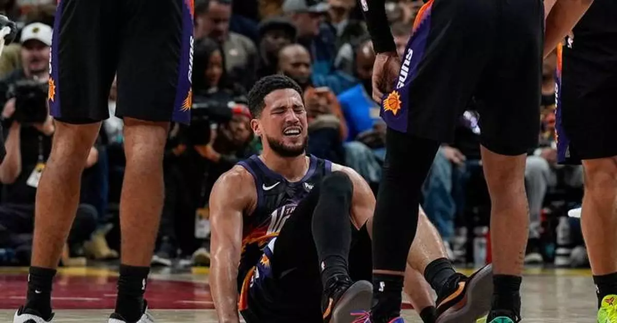 Suns All-Star guard Devin Booker to miss at least a week with sprained ankle