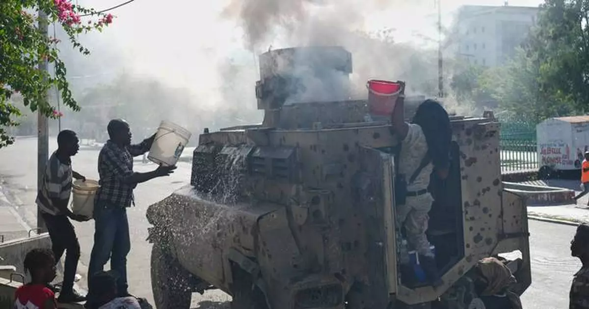 Veteran AP videographer describes grisly images and 'burning smoke' of a Haitian gang attack