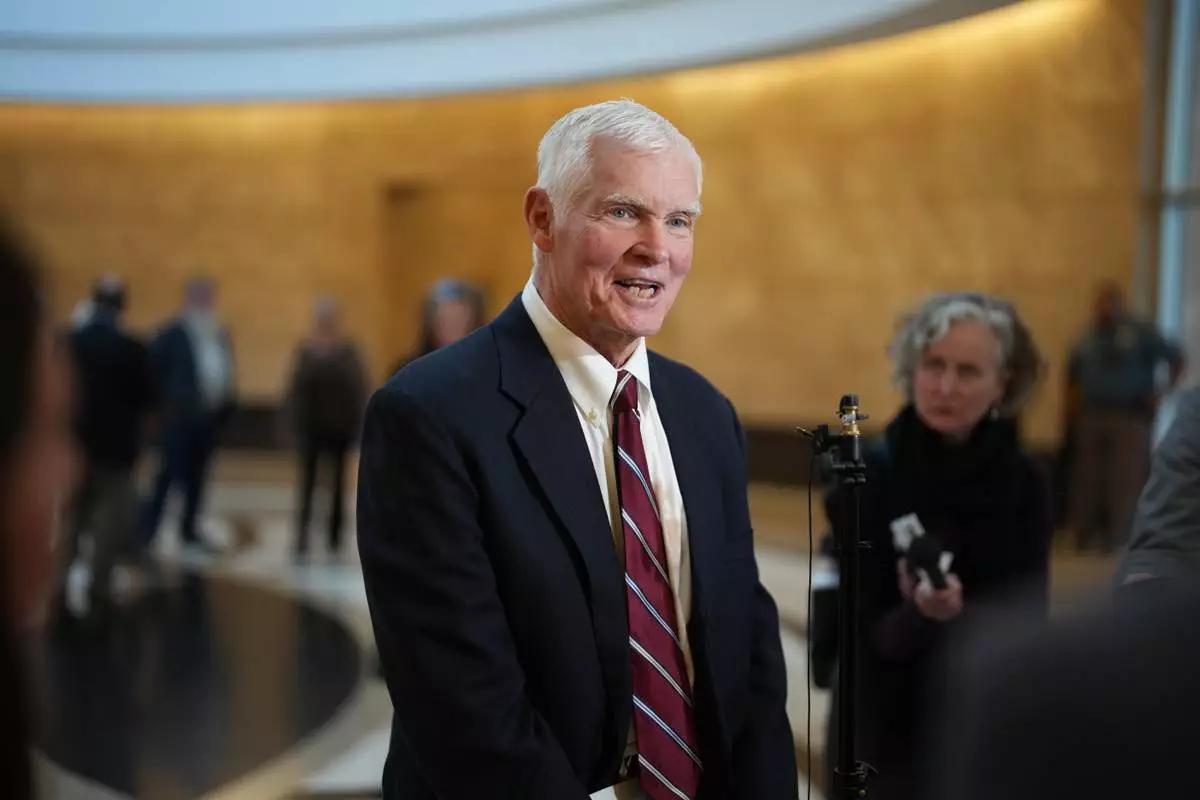 Attorney John Case talks to reporters after a hearing to urge a state appeals court to overturn the convictions against former Colorado elections clerk and Donald Trump ally Tina Peters for orchestrating a data breach of her county's elections equipment Wednesday, Jan. 14, 2026, in Denver. (AP Photo/David Zalubowski)