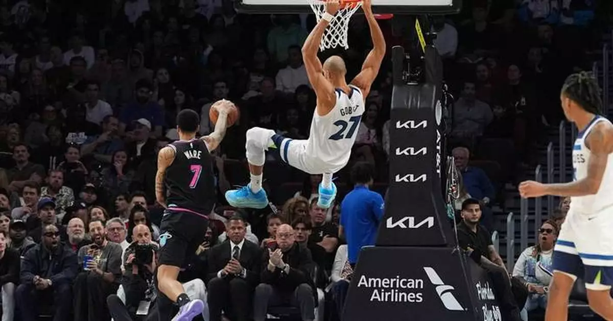 Edwards and Reid combine for 62, Timberwolves win 125-115 to snap Heat's 4-game winning streak