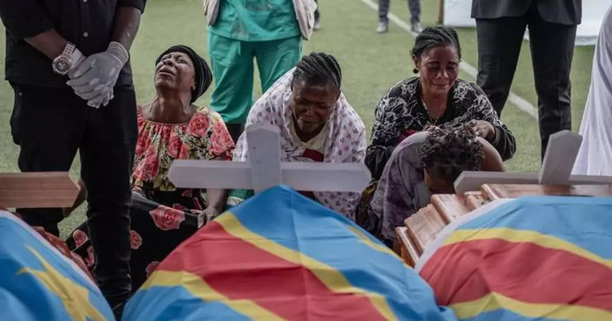 M23 rebel group holds a symbolic funeral for victims of drone strike in eastern Congo