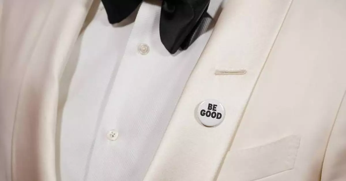 Celebrities wear pins protesting ICE on the Golden Globes red carpet