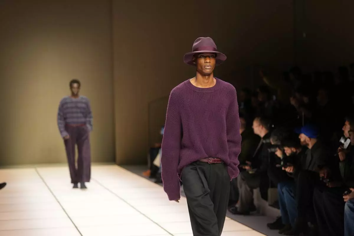 A model wears a creation as part of the Giorgio Armani Fall/Winter 2026-2027 Men's collection presented in Milan, Italy, Monday, Jan. 19, 2026. (AP Photo/Antonio Calanni)