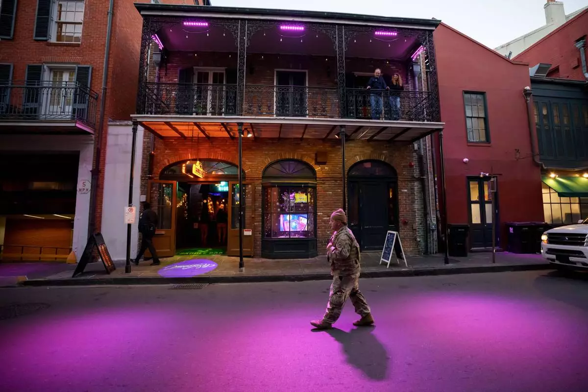 FILE - The Louisiana National Guard, military police, and Louisiana law enforcement patrol the French Quarter as part of a National Guard deployment for New Year's celebrations in New Orleans, Dec. 30, 2025. (AP Photo/Matthew Hinton, File)