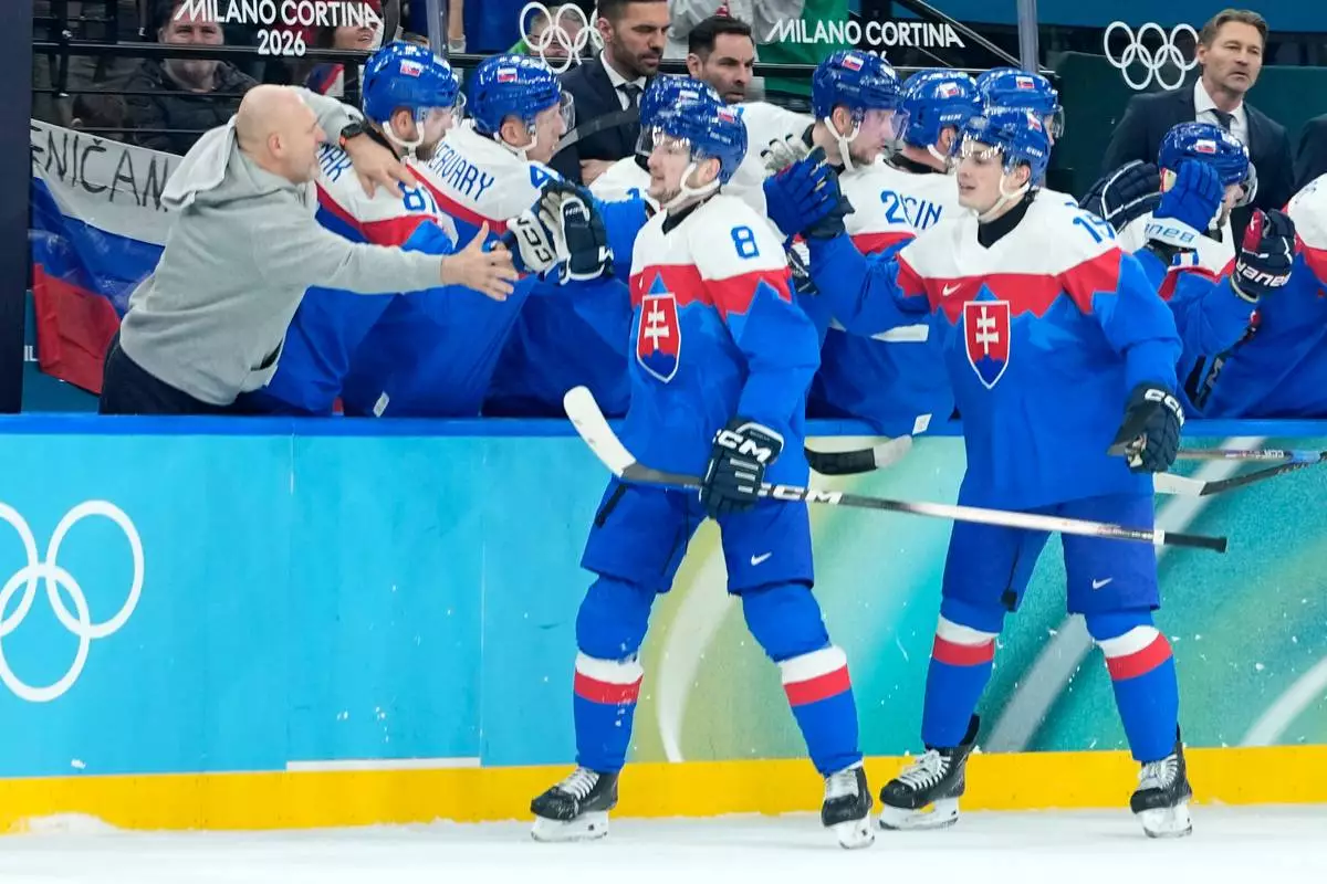 Slovakia's Oliver Okuliar (8) and Slovakia's Dalibor Dvorsky (15) celebrate their side's third goal during a men's ice hockey quarterfinal game between Slovakia and Germany at the 2026 Winter Olympics, in Milan, Italy, Wednesday, Feb. 18, 2026. (AP Photo/Petr David Josek)