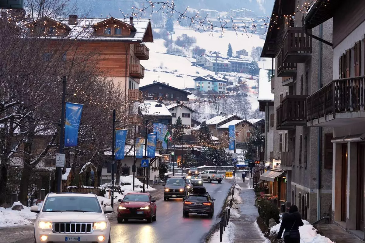 Olympic signs and decorations adorn a street in Bormio, Italy, at the 2026 Winter Olympics, Wednesday, Feb. 4, 2026. (AP Photo/Rebecca Blackwell)