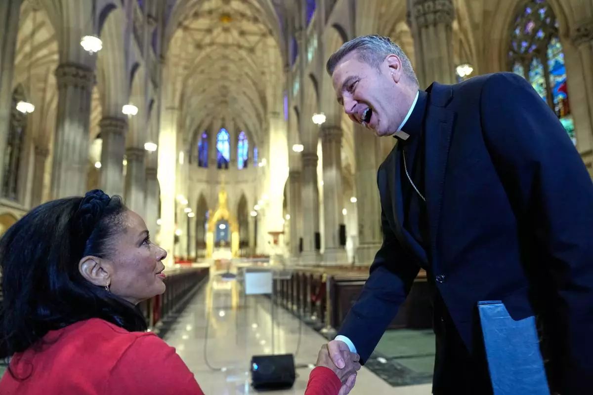 Archbishop-designate Ronald Hicks greets journalists before a news conference at St. Patrick's Cathedral in New York, Thursday, Feb. 5, 2026. (AP Photo/Seth Wenig)