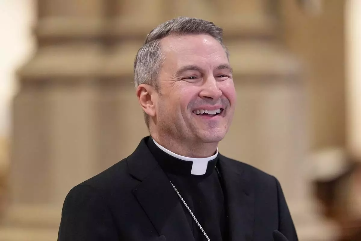 Archbishop-designate Ronald Hicks laughs during a news conference at St. Patrick's Cathedral in New York, Thursday, Feb. 5, 2026. (AP Photo/Seth Wenig)