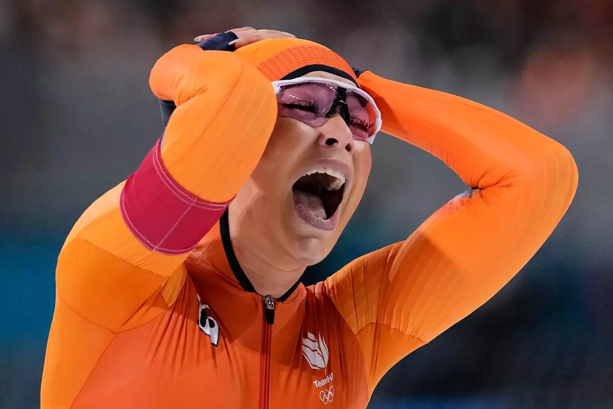Jutta Leerdam of the Netherlands celebrates winning the gold medal in the women's 1,000 meters speedskating race at the 2026 Winter Olympics, in Milan, Italy, Monday, Feb. 9, 2026. (AP Photo/Ben Curtis)