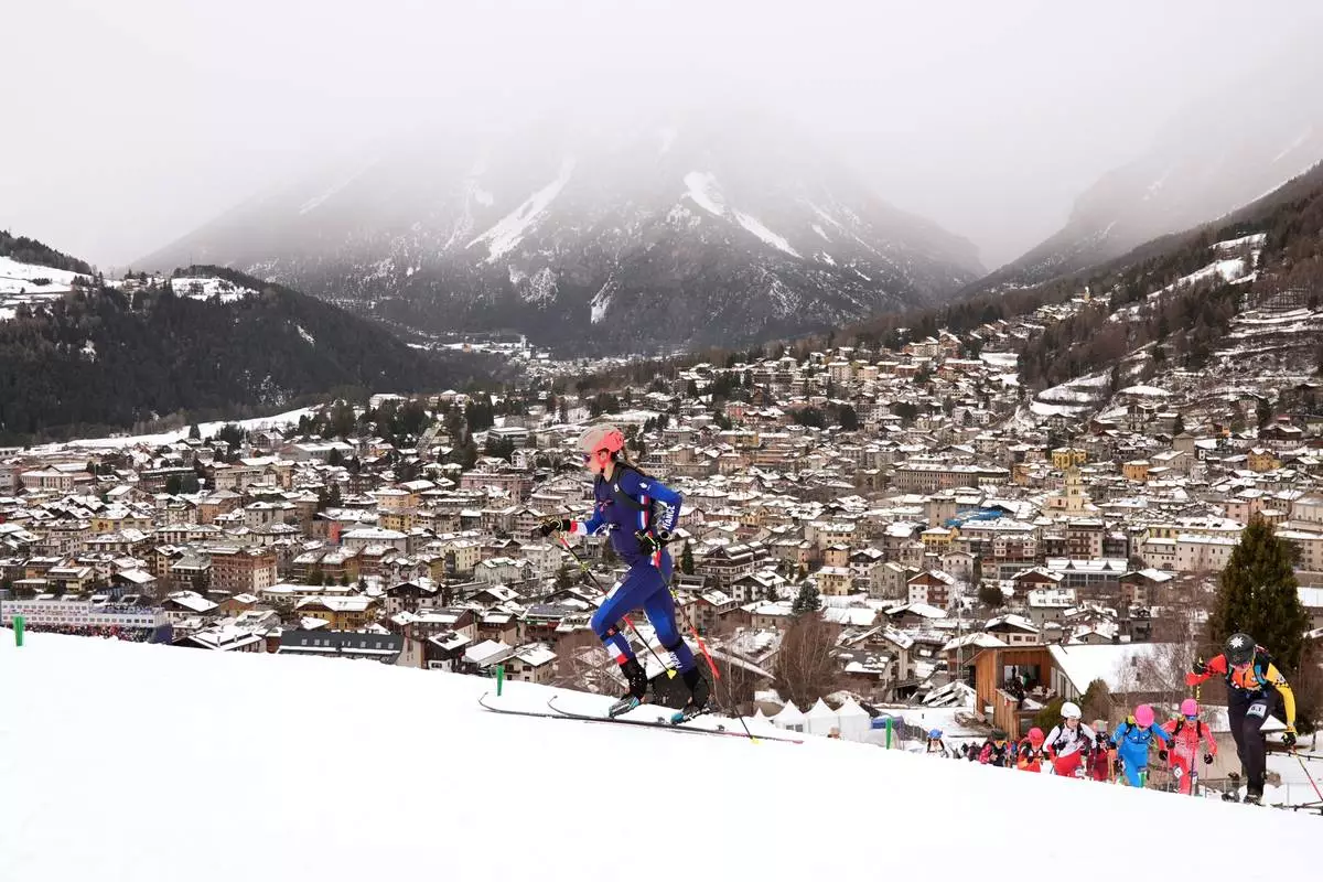 France's Emily Harrop competes during a ski mountaineering mixed relay, at the 2026 Winter Olympics, in Bormio, Italy, Saturday, Feb. 21, 2026. (AP Photo/Rebecca Blackwell)