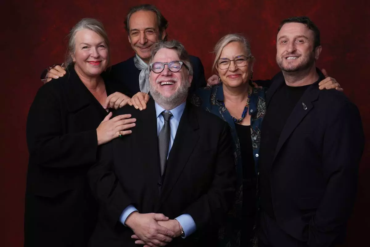 Kate Hawley, from left, Alexandre Desplat, Guillermo del Toro, Tamara Deverell, and Mike Hill pose for a portrait during the 98th Academy Awards Oscar nominees luncheon on Tuesday, Feb. 10, 2026, at the Beverly Hilton Hotel in Beverly Hills, Calif. (AP Photo/Chris Pizzello)