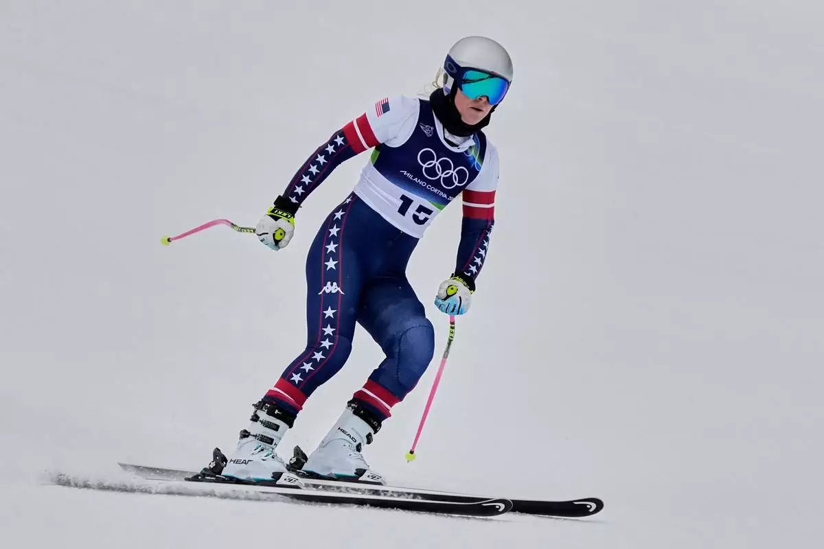 United States' Lindsey Vonn arrives at the finish area of an alpine ski women's downhill training, at the 2026 Winter Olympics, in Cortina d'Ampezzo, Italy, Saturday, Feb. 7, 2026. (AP Photo/Andy Wong)