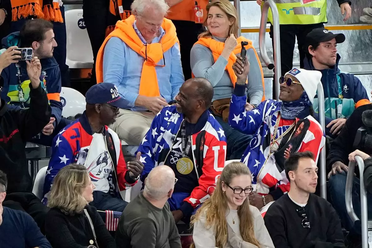 Snoop Dog watches the women's 500 meters speedskating race at the 2026 Winter Olympics, in Milan, Italy, Sunday, Feb. 15, 2026. (AP Photo/Ben Curtis)