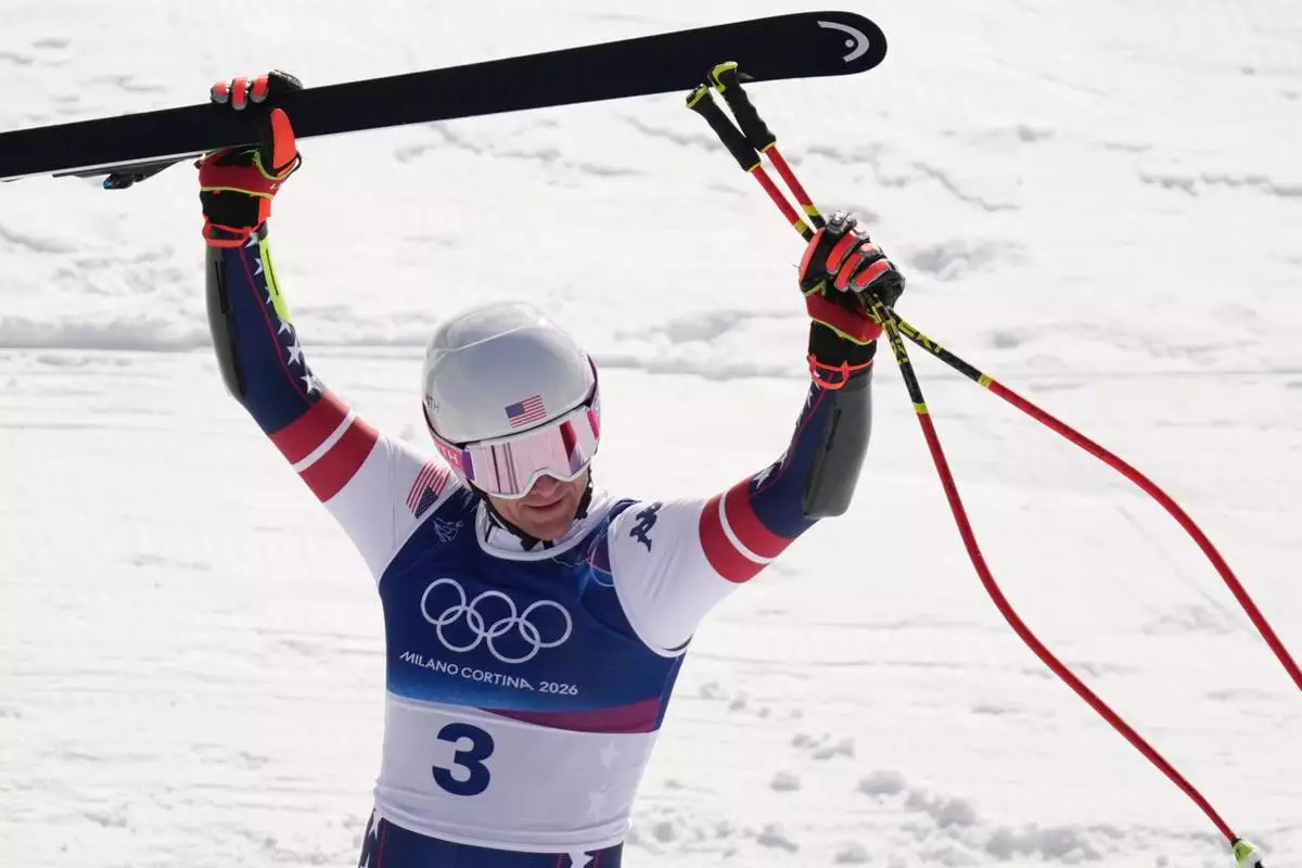 United States' Ryan Cochran Siegle celebrates at the finish area of an alpine ski, men's super-G race, at the 2026 Winter Olympics, in Bormio, Italy, Wednesday, Feb. 11, 2026. (AP Photo/Rebecca Blackwell)