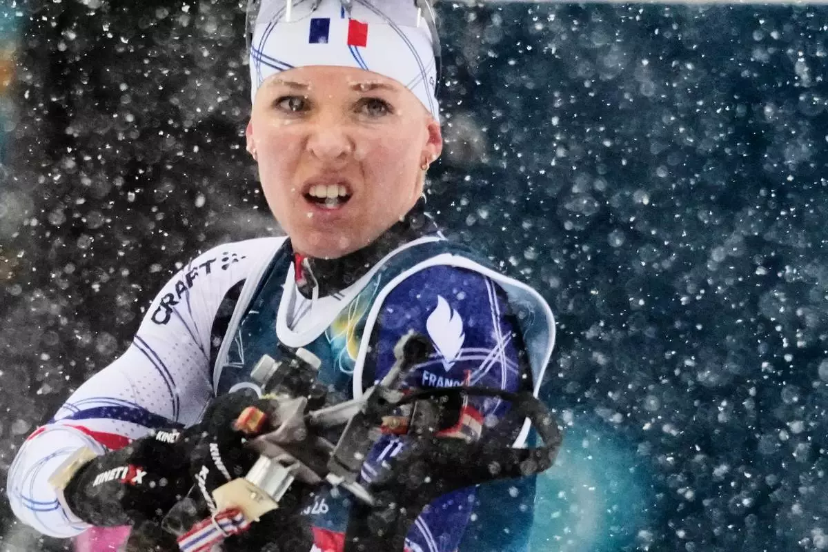 Oceane Michelon of France competes during the Biathlon Women's 12.5km Mass Start at the 2026 Winter Olympics, in Anterselva, Italy, Saturday, Feb. 21, 2026. (AP Photo/Christophe Ena)