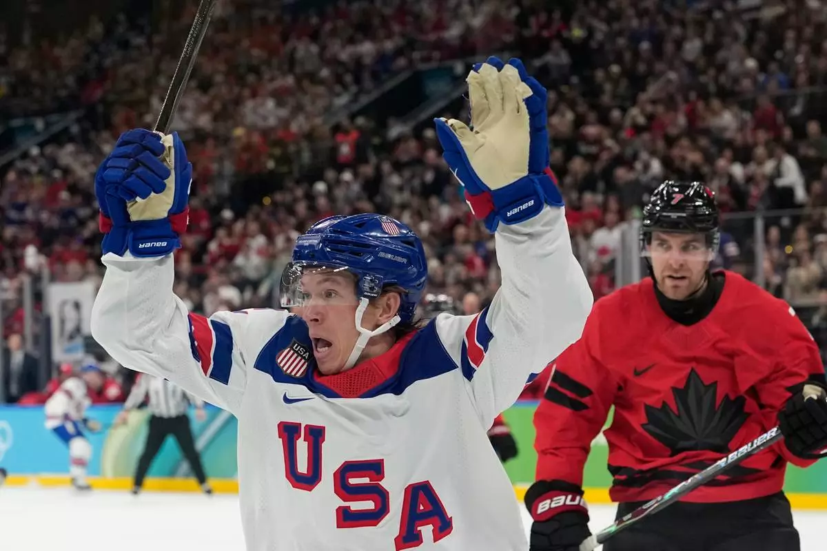 United States' Matt Boldy, celebrates after scoring the opening goal during a men's ice hockey gold medal game between Canada and the United States at the 2026 Winter Olympics, in Milan, Italy, Sunday, Feb. 22, 2026. (AP Photo/Hassan Ammar)