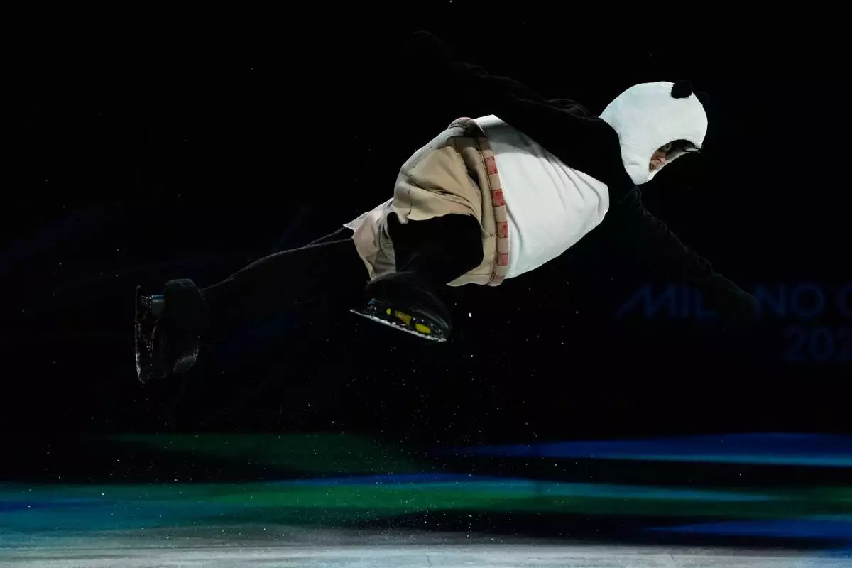 Mikhail Shaidorov of Kazakhstan, gold medalist of the men's single skating competition, performs during the figure skating exhibition at the 2026 Winter Olympics, in Milan, Italy, Saturday, Feb. 21, 2026. (AP Photo/Ashley Landis)