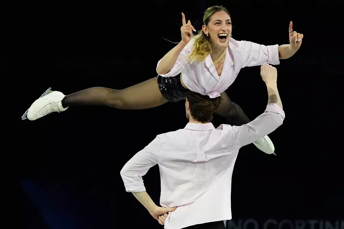 Sara Conti and Niccolo Macii of Italy perform during the figure skating exhibition at the 2026 Winter Olympics, in Milan, Italy, Saturday, Feb. 21, 2026. (AP Photo/Ashley Landis)