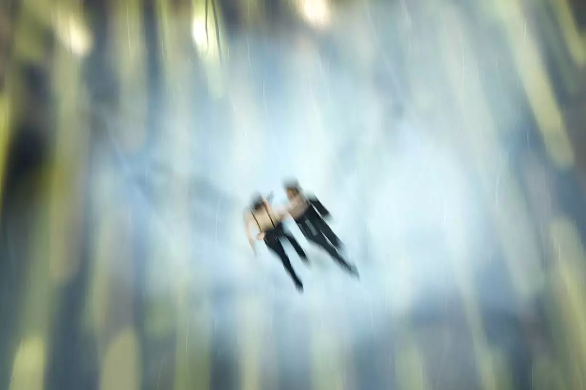 llison Reed / Saulius Ambrulevicius of Lituania perform during an exhibition gala at the 2026 Winter Olympics, in Milan, Italy, Saturday, Feb. 21, 2026. (AP Photo/Christophe Ena)