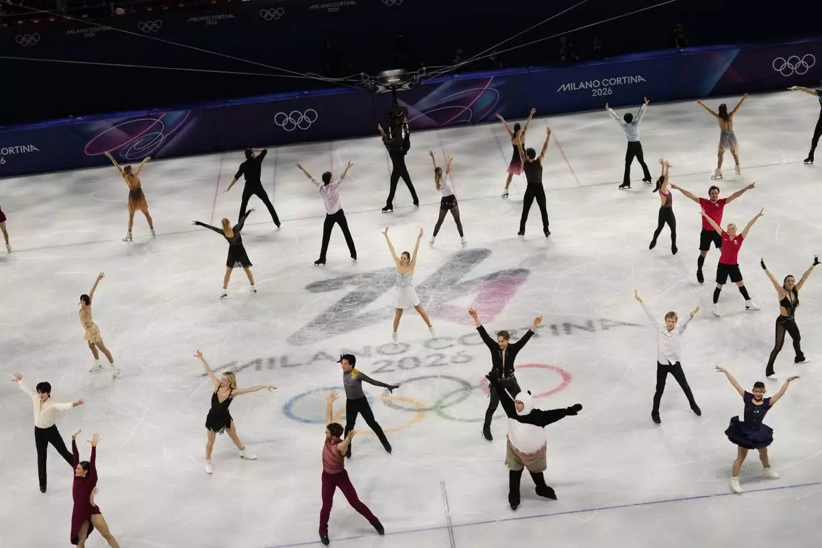 Athletes perform together during the figure skating exhibition at the 2026 Winter Olympics, in Milan, Italy, Saturday, Feb. 21, 2026. (AP Photo/Francisco Seco)