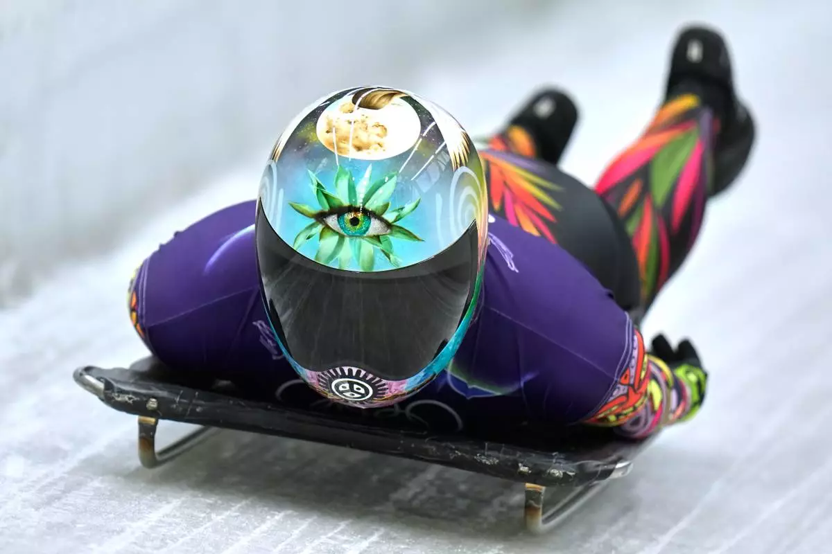 Puerto Rico's Kellie Delka arrives at the finish during a women's skeleton training session at the 2026 Winter Olympics, in Cortina d'Ampezzo, Italy, Tuesday, Feb. 10, 2026. (AP Photo/Alessandra Tarantino)
