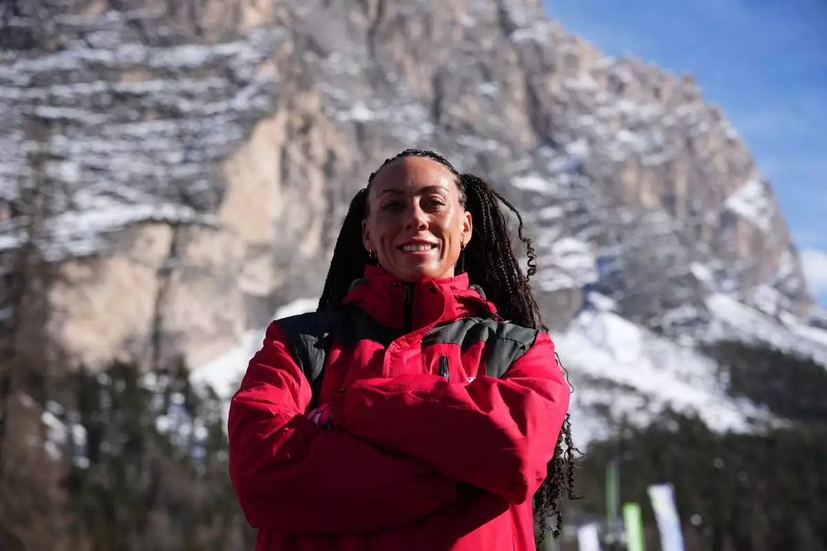 Puerto Rico's Kellie Delka poses at the 2026 Winter Olympics, in Cortina d'Ampezzo, Italy, Sunday, Feb. 8, 2026. (AP Photo/Alessandra Tarantino)