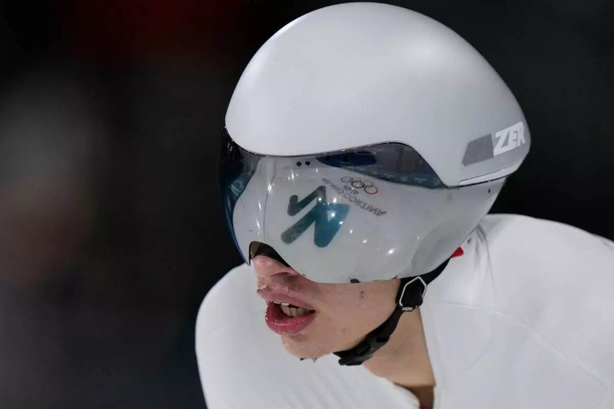 Vladimir Semirunniy of Poland catches his breath after the men's 10,000 meters speedskating race at the 2026 Winter Olympics, in Milan, Italy, Friday, Feb. 13, 2026. (AP Photo/Luca Bruno)