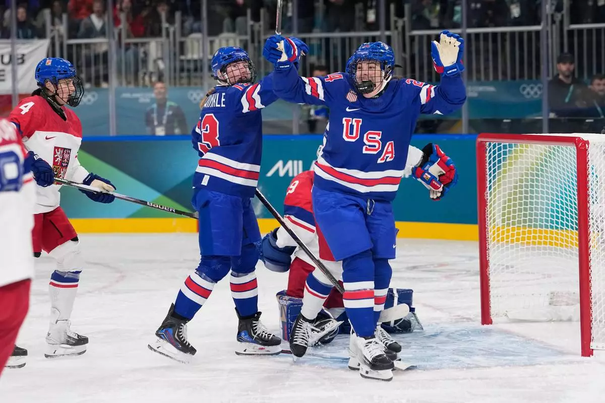 United States' Joy Dunne, right, celebrates after scoring her sides second goal during a preliminary round match of women's ice hockey between United States and Czechia at the 2026 Winter Olympics, in Milan, Italy, Thursday, Feb. 5, 2026. (AP Photo/Petr David Josek)