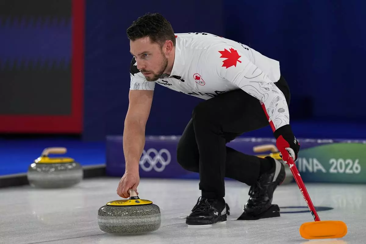 Canada's Brett Gallant in action during the mixed doubles round robin phase of the curling competition against Britain at the 2026 Winter Olympics, in Cortina d'Ampezzo, Italy, Saturday, Feb. 7, 2026. (AP Photo/Fatima Shbair)