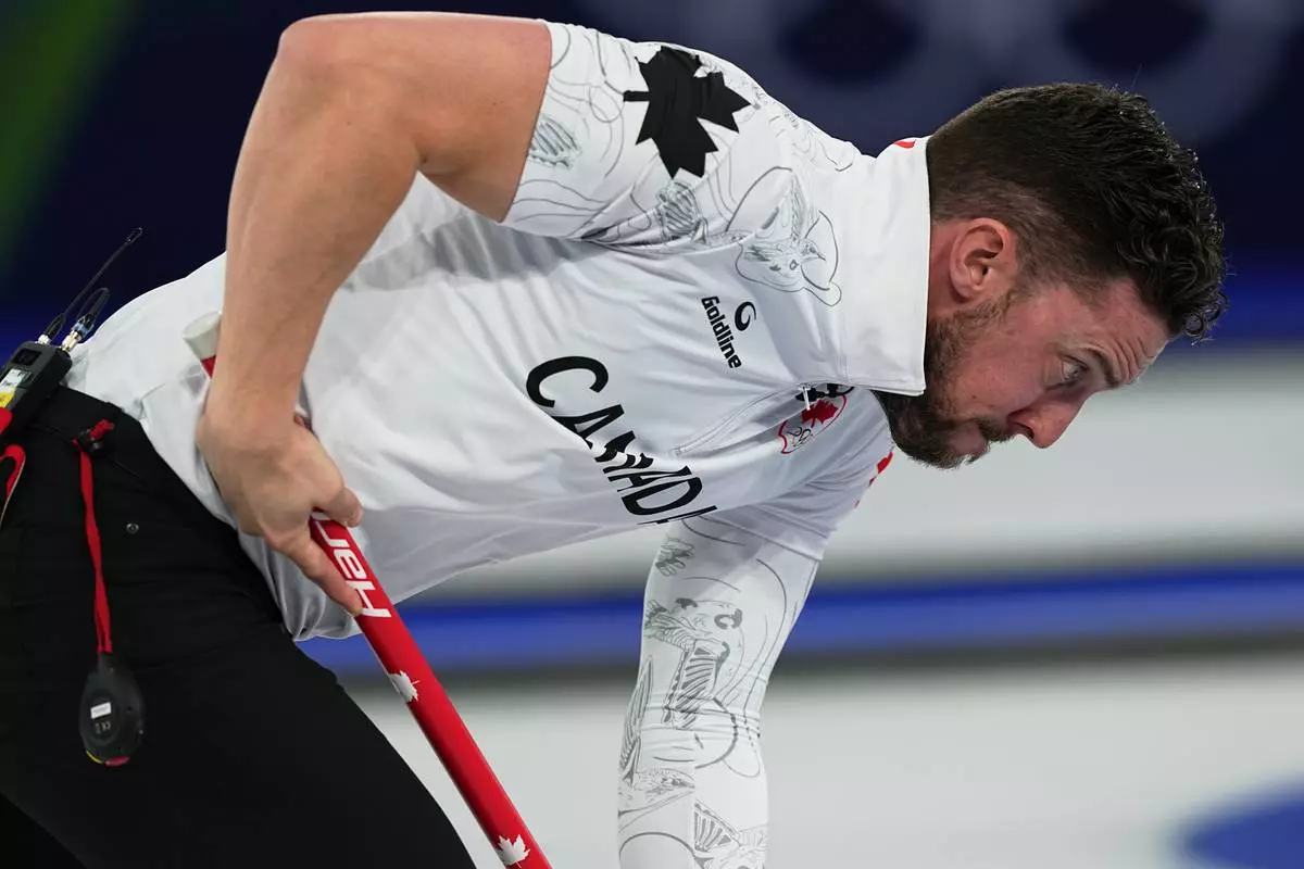 Canada's Brett Gallant in action during the mixed doubles round robin phase of the curling competition against Britain at the 2026 Winter Olympics, in Cortina d'Ampezzo, Italy, Saturday, Feb. 7, 2026. (AP Photo/Fatima Shbair)