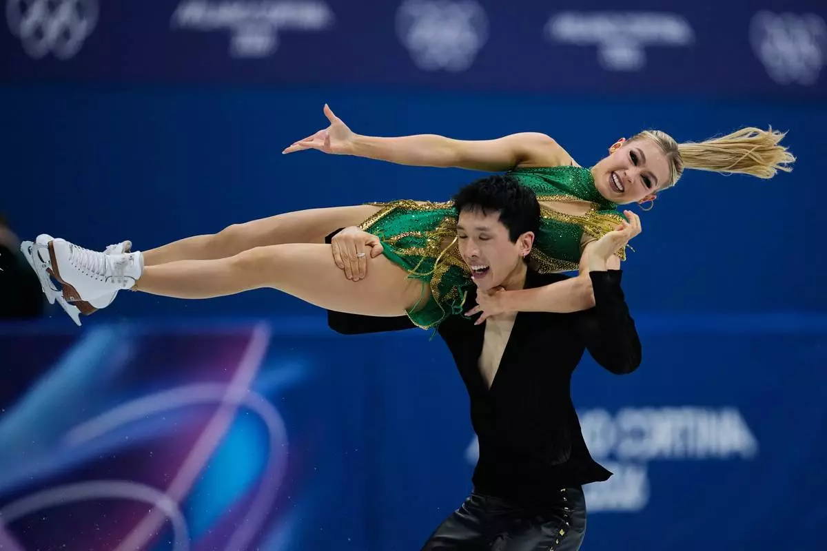 Holly Harris and Jason Chan of Australia compete during the rhythm dance in figure skating at the 2026 Winter Olympics, in Milan, Italy, Monday, Feb. 9, 2026. (AP Photo/Ashley Landis)