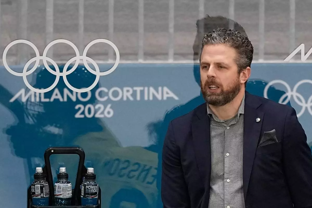 Sweden's Head Coach Ulf Lundberg gestures during a preliminary round match of women's ice hockey between France and Sweden at the 2026 Winter Olympics, in Milan, Italy, Sunday, Feb. 8, 2026. (AP Photo/Petr David Josek)