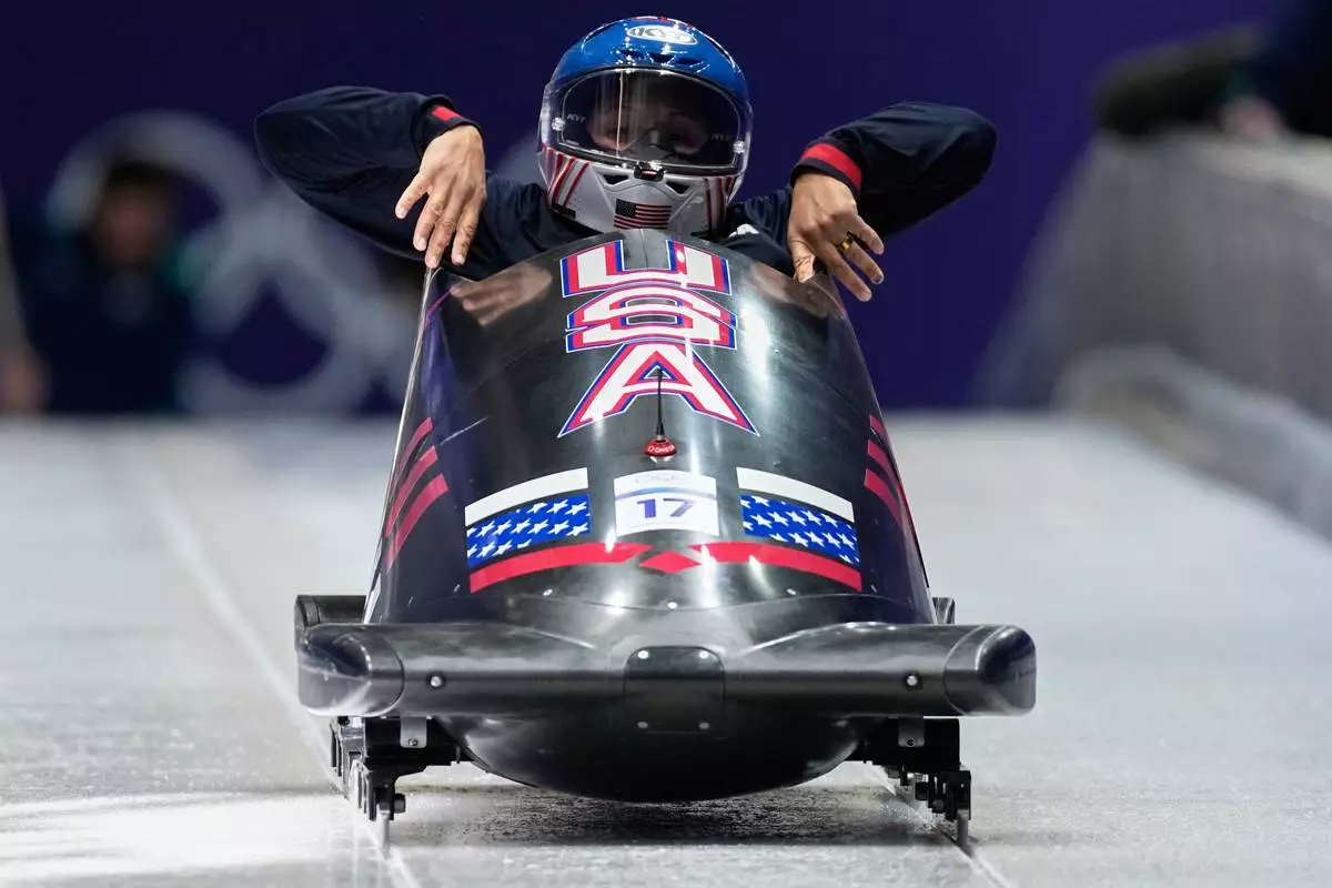 United States' Elana Meyers Taylor starts for a women's monobob training session at the 2026 Winter Olympics, in Cortina d'Ampezzo, Italy, Friday, Feb. 13, 2026. (AP Photo/Aijaz Rahi)