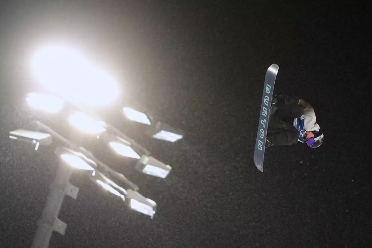 China's Yang Wenlong practices during a snowboard big air training session at the 2026 Winter Olympics, in Livigno, Italy, Wednesday, Feb. 4, 2026. (AP Photo/Lindsey Wasson)