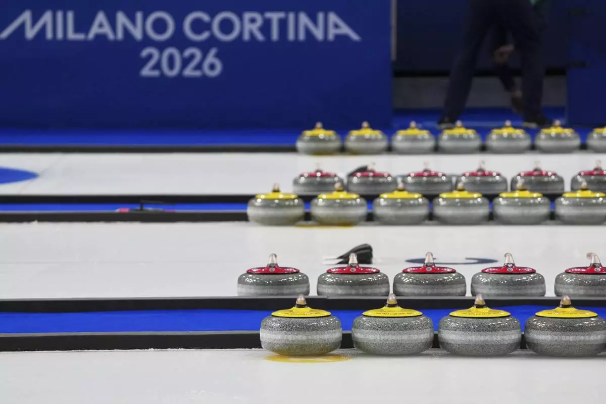 Curling stones are pictured before the bronze medal mixed doubles match competition at the 2026 Winter Olympics, in Cortina d'Ampezzo, Italy, Tuesday, Feb. 10, 2026. (AP Photo/Misper Apawu)