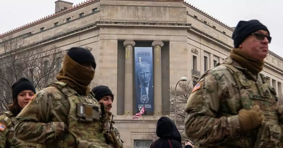 Large banner featuring Trump's face is displayed on Justice Department headquarters