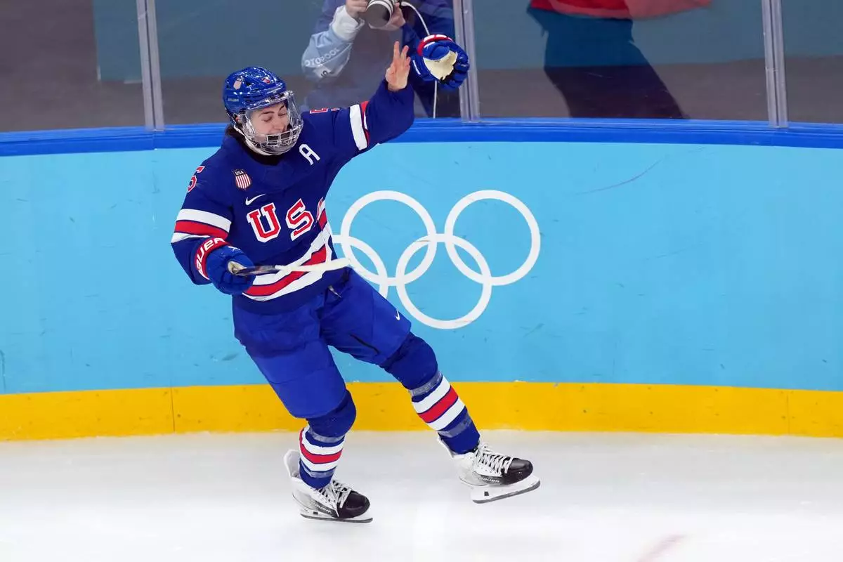United States' Megan Keller celebrates after scoring the winning goal against Canada during the overtime period of the women's ice hockey gold medal game at the 2026 Winter Olympics, in Milan, Italy, Thursday, Feb. 19, 2026. (AP Photo/Carolyn Kaster)