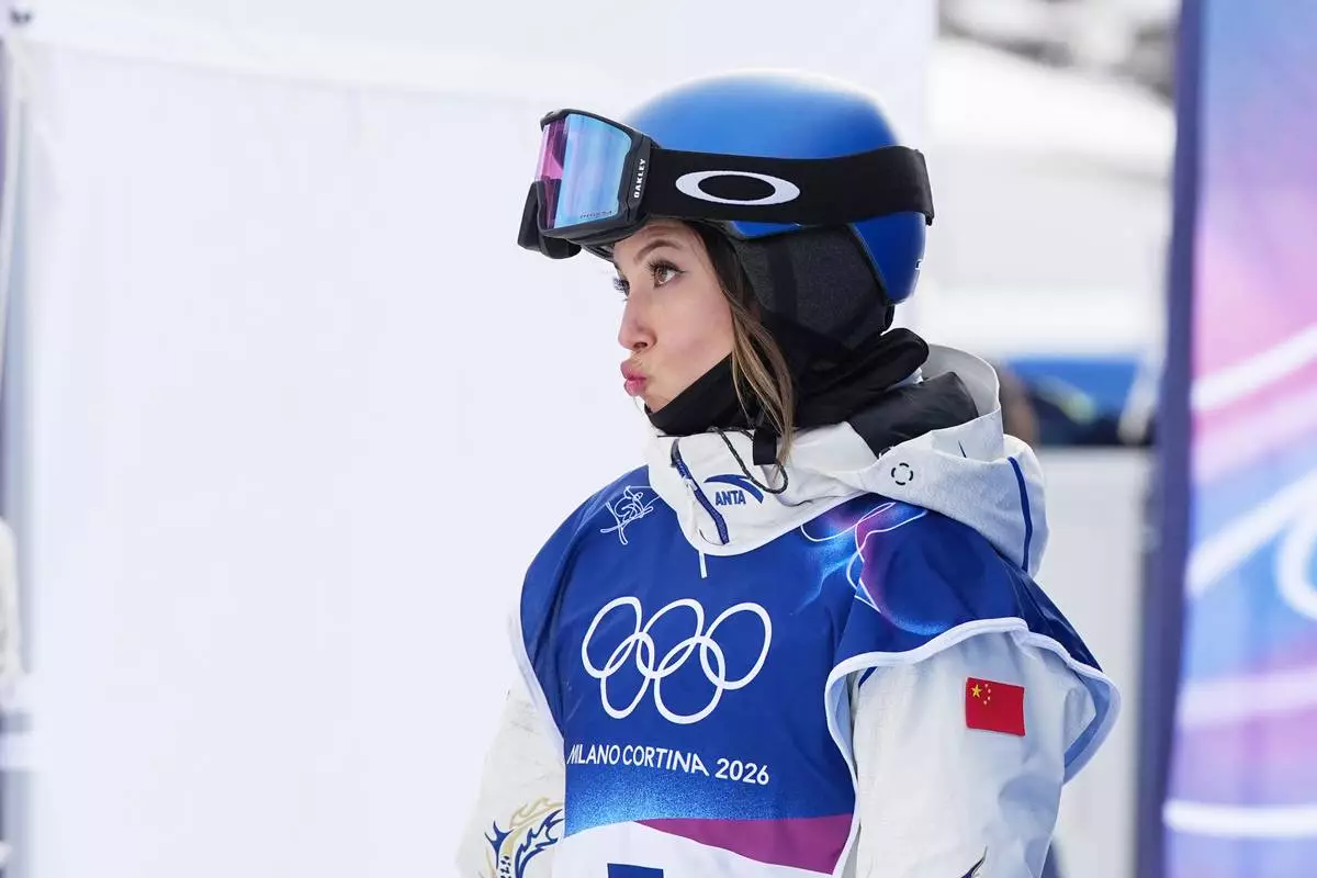 China's Eileen Gu reacts during the women's freestyle skiing slopestyle finals at the 2026 Winter Olympics, in Livigno, Italy, Monday, Feb. 9, 2026. (AP Photo/Gregory Bull)